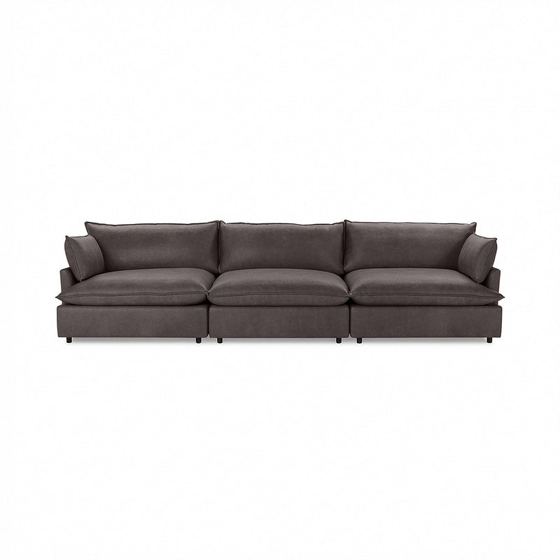 Classic Home Caplan modular sectional sofa with plush cushions and fabric upholstery, shown in a modern stationary sectional design.