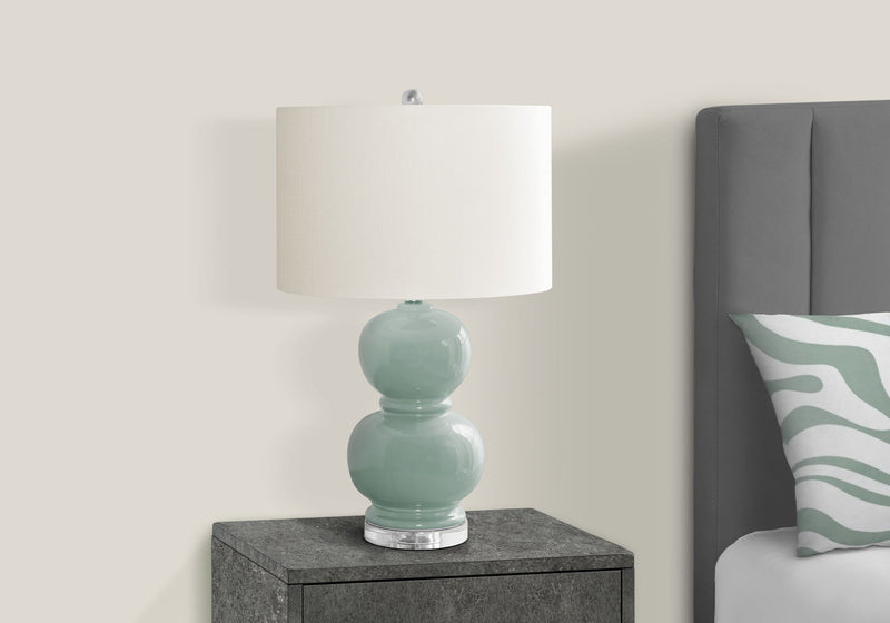 Modern 8th Street contemporary table lamp with a sleek design and neutral-colored shade, ideal for living room or bedside lighting.