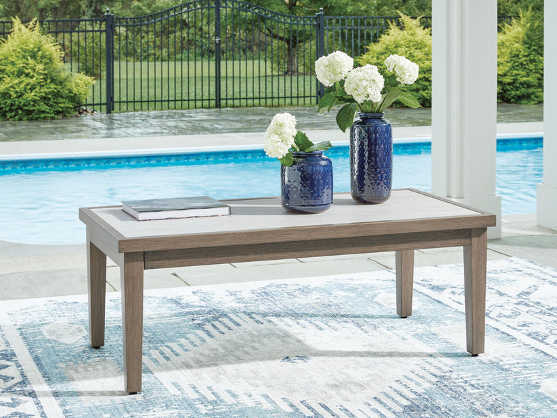 Rectangular brown and beige Rainier Ranch coffee table by Signature Design by Ashley® with a sleek, modern design and wooden finish.