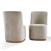 Set of two Noble House indoor upholstered dining chairs with padded seats and high backs, in a modern design.