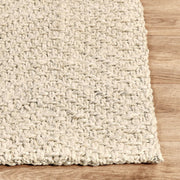Classic Home herringbone jute rug with natural woven texture, ideal for area decor in living or dining spaces.