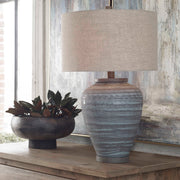 Uttermost Pelia table lamp in light aqua with a modern ceramic base and fabric shade, ideal for contemporary home decor.