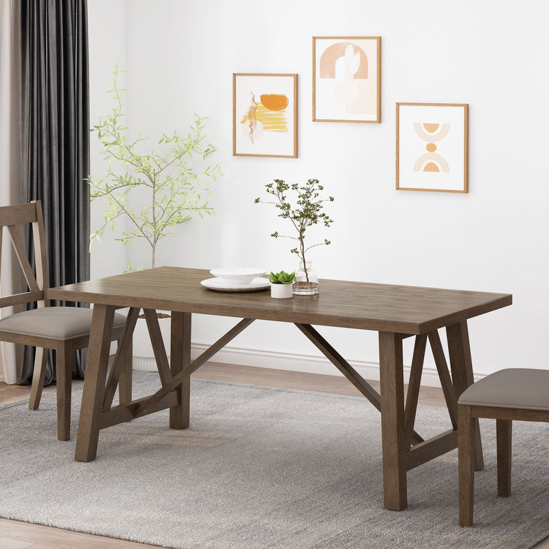 Noble House farmhouse style dining table with wood-like top and sturdy wooden legs, perfect for rustic kitchen or dining room.