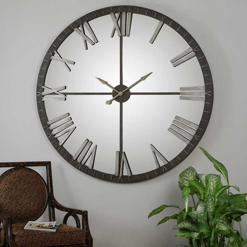 Large bronze wall clock from Uttermost's Amelie collection, featuring a stylish round design with bold numerals.