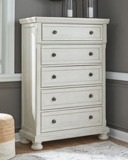 Ashley Robbinsdale sleigh bedroom set with six pieces, including a bed frame, nightstands, dresser, and mirror in a classic style.