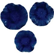 Set of three ceramic wall decor pieces by Uttermost, featuring modern abstract designs for stylish wall accents.