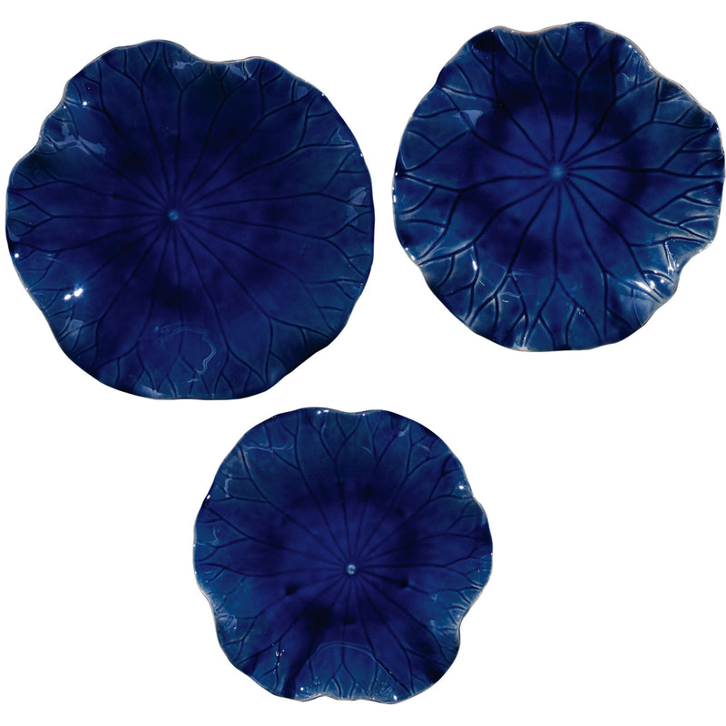 Set of three ceramic wall decor pieces by Uttermost, featuring modern abstract designs for stylish wall accents.