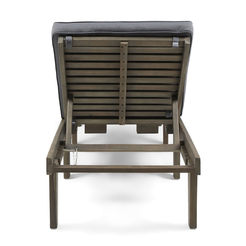 Noble House Ariana wood chaise lounge with beige cushion, curved frame and modern design for relaxing indoor or outdoor use.