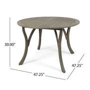 Hermosa outdoor acacia wood circular dining table by Noble House, showing a sturdy, natural wood surface suitable for outdoor dining.