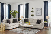 Signature Design by Ashley Vayda living room set with stationary chair and ottoman, featuring plush upholstery and modern style.