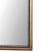 Antiqued gold wall mirror by Uttermost, Adelasia style with an elegant, vintage-inspired frame reflecting classic decor.