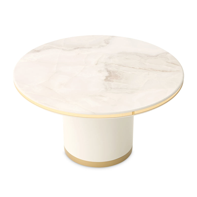 Michael Amini Gineverra round cocktail table in ivory and gold with elegant curved legs and decorative details.