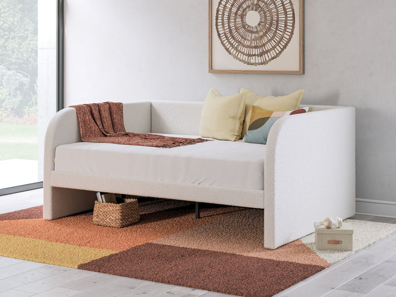 Signature Design by Ashley upholstered Arloster day bed with plush fabric and elegant frame, ideal for versatile living spaces.