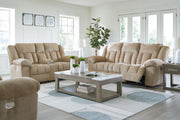 Signature Design by Ashley reclining living room set with plush sofas and loveseats, featuring comfortable reclining seats and modern style.