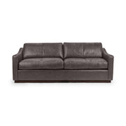 Classic Home Aspen stationary sofa with plush cushions and sleek armrests, showcasing its elegant beige fabric and modern design.