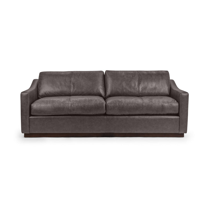 Classic Home Aspen stationary sofa with plush cushions and sleek armrests, showcasing its elegant beige fabric and modern design.