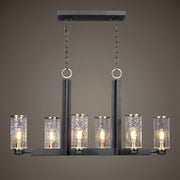 Uttermost Jarsdel 6-light industrial island pendant light in black with metal jar-shaped shades over kitchen island.