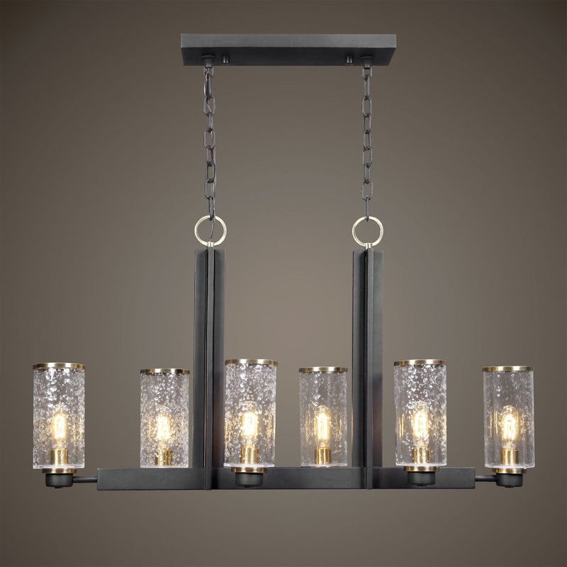 Uttermost Jarsdel 6-light industrial island pendant light in black with metal jar-shaped shades over kitchen island.