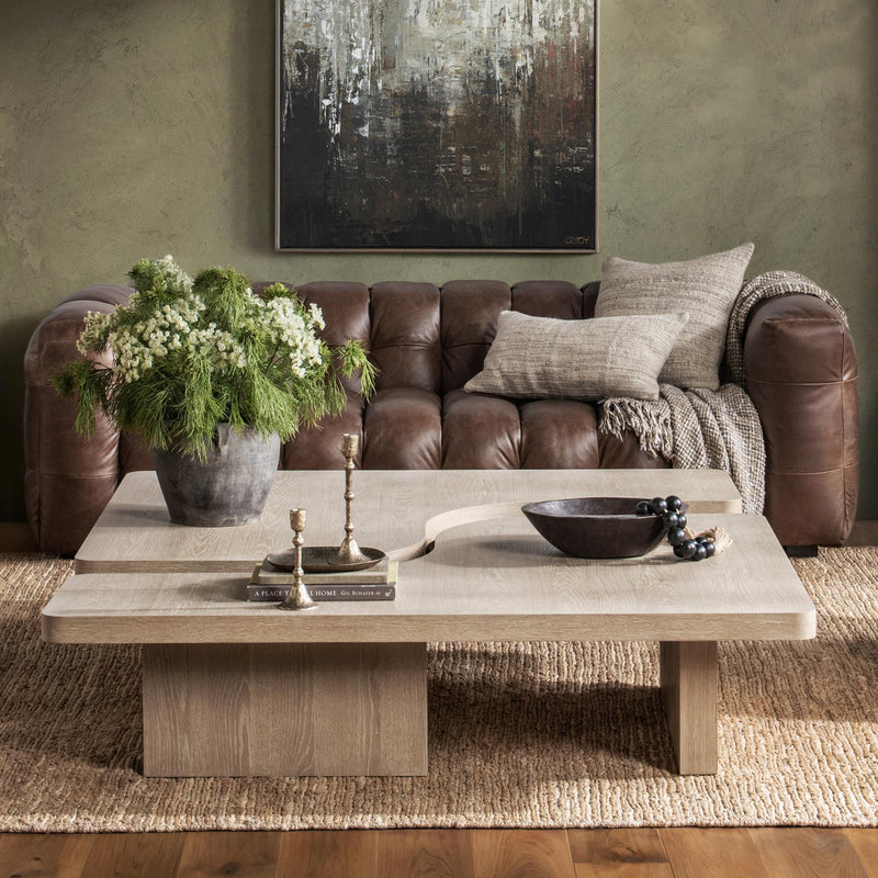 Modern Melina coffee table by Classic Home featuring a sleek wooden surface and sturdy metal legs.