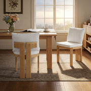 Set of two Noble House indoor dining chairs with wooden legs and cushioned seats for stylish comfort.