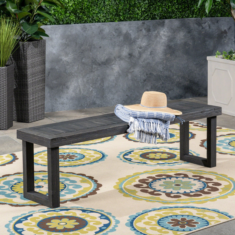 Noble House Realm outdoor bench with dark gray slat panel top and base, sturdy and stylish for outdoor seating.