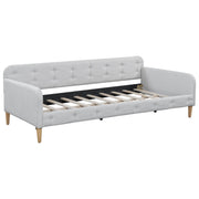 Modern Dreamland upholstered daybed with plush fabric and sleek design, featuring a sturdy frame and comfortable seating area.