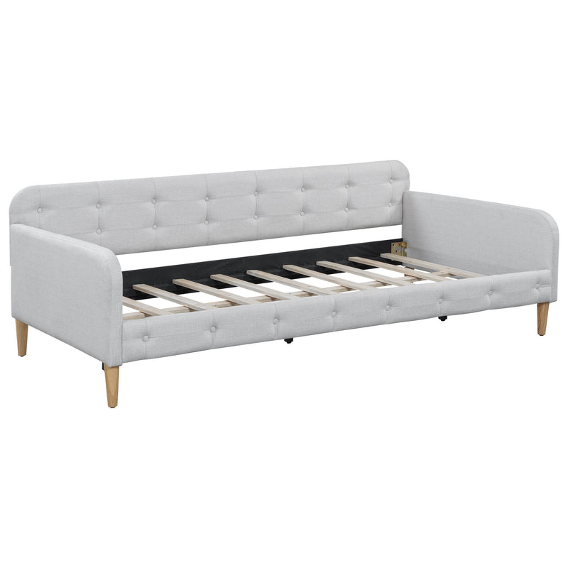 Modern Dreamland upholstered daybed with plush fabric and sleek design, featuring a sturdy frame and comfortable seating area.