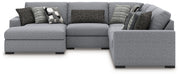 Benchcraft Bealton stationary sectional sofa with plush cushions and fabric upholstery, shown in a modern living room setting.