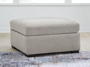 Benchcraft® ModMax Luxe oversized accent ottoman in Flint fabric, showing plush, contemporary design and soft textured upholstery.