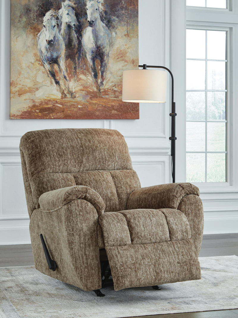 Signature Design by Ashley Stayfish rocker recliner with plush cushioning and wooden base, perfect for relaxing and lounging.