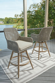 Set of two Seton Creek barstools with beige and gray cushions by Signature Design Ashley, featuring a modern stool set design.
