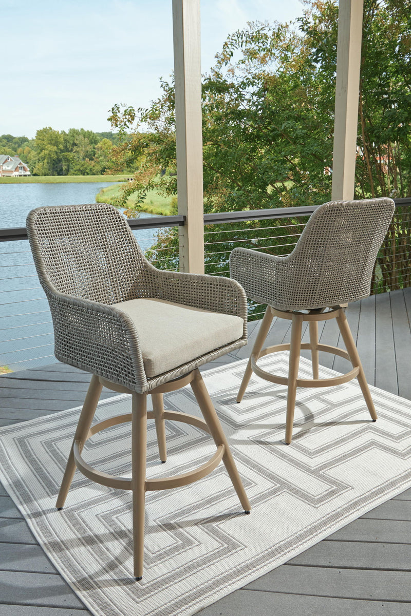 Set of two Seton Creek barstools with beige and gray cushions by Signature Design Ashley, featuring a modern stool set design.