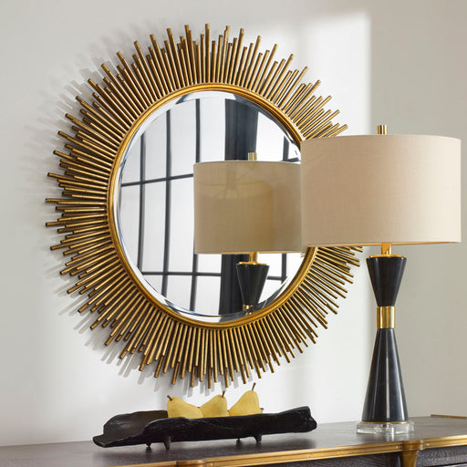 Uttermost Marlo round gold wall mirror with a sleek, modern design and reflective surface for stylish home decor.