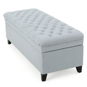 Juliana storage ottoman with birch wood legs, upholstered in neutral fabric, featuring a spacious top for storage and seating.