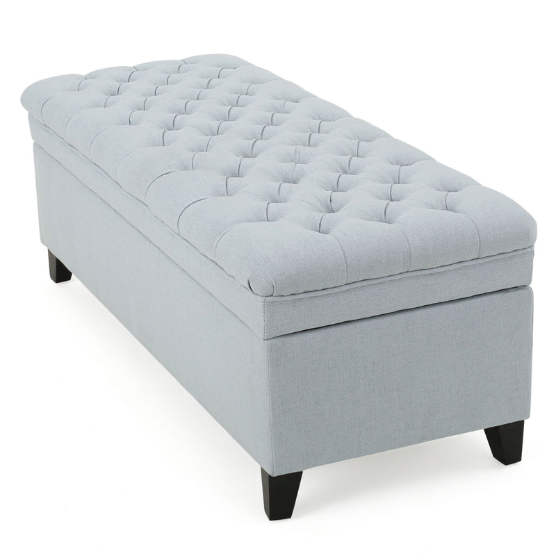 Juliana storage ottoman with birch wood legs, upholstered in neutral fabric, featuring a spacious top for storage and seating.