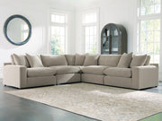 Benchcraft® Maxton Heights stationary sectional with plush fabric and modern design, featuring multiple seating areas and clean lines.