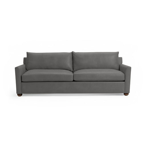 Classic Home Olivia stationary sofa with plush fabric and elegant design, shown in a modern living room setting.
