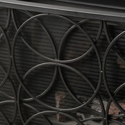 Noble House Thayer single panel iron fireplace screen with geometric design, featuring black metal and decorative cutouts.
