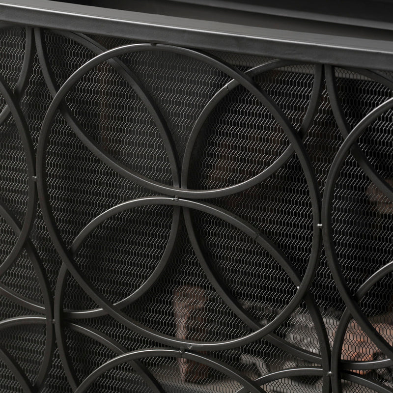 Noble House Thayer single panel iron fireplace screen with geometric design, featuring black metal and decorative cutouts.
