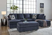 Signature Design by Ashley Albar Place 3-piece sectional with ottoman in a modern living room setup