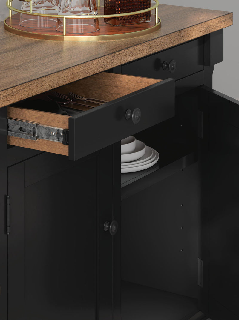 Wildenauer dining room buffet by Signature Design Ashley in brown and black with drawers and cabinet doors for storage.