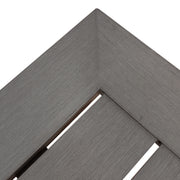 Dark gray Noble House modern aluminum outdoor dining bench with X base, showcasing sleek and durable design for outdoor seating.