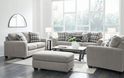 Signature Design by Ashley Avenal Park living room set with stationary chair and ottoman in neutral upholstery.