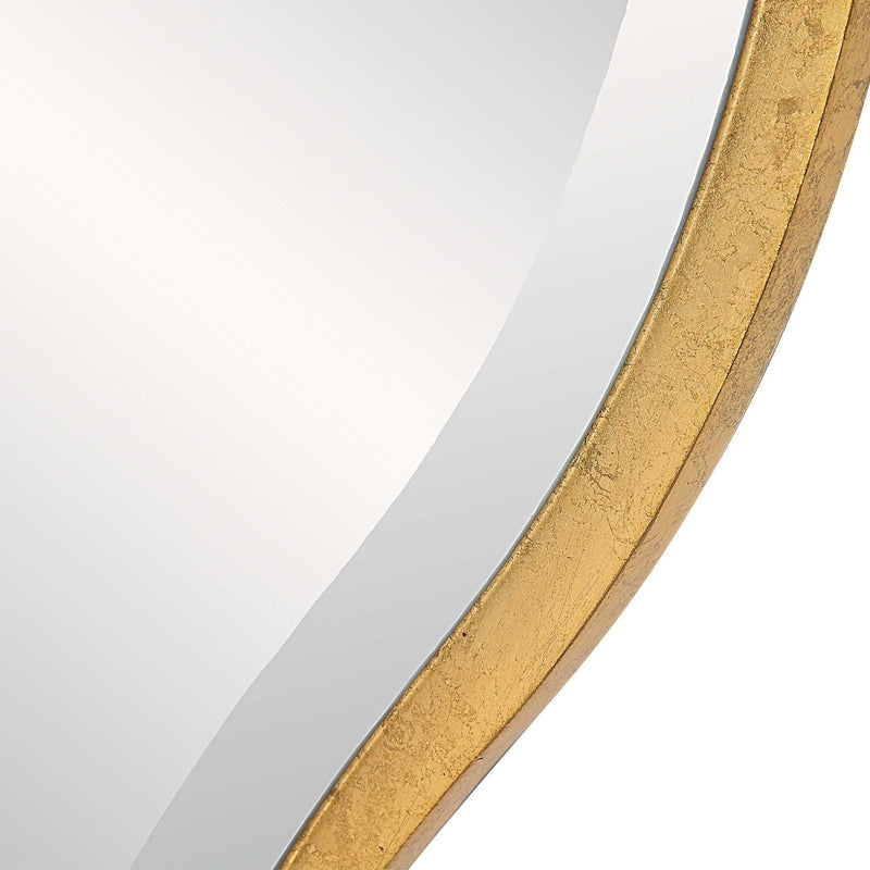 Uttermost Aneta round wall mirror with a sleek modern frame, hanging on a wall for stylish home decor.