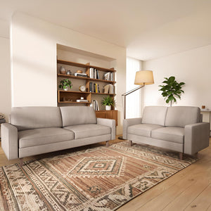 Beige US Pride 3-seat sofa with removable cushions and stationary design, showcasing plush upholstery and ample seating space.