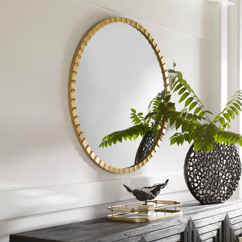 Uttermost Dandridge round industrial wall mirror with a metal frame, ideal for modern industrial interior decor.