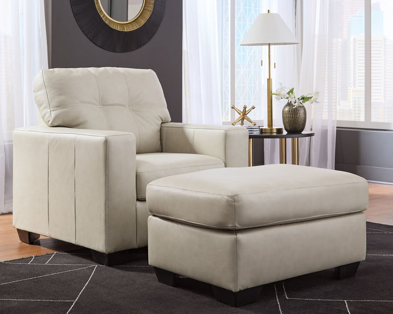 Signature Design by Ashley Santorine living room set with stationary chair and ottoman, featuring plush upholstery and modern style.