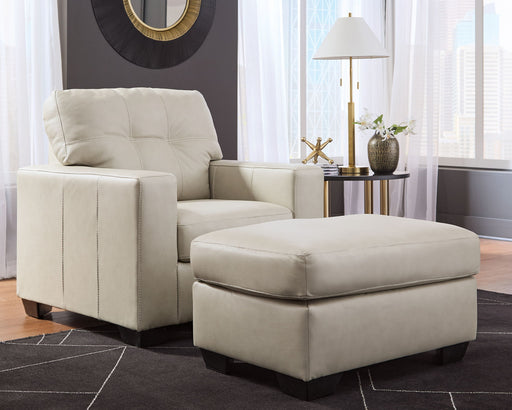Signature Design by Ashley Santorine living room set with stationary chair and ottoman, featuring plush upholstery and modern style.