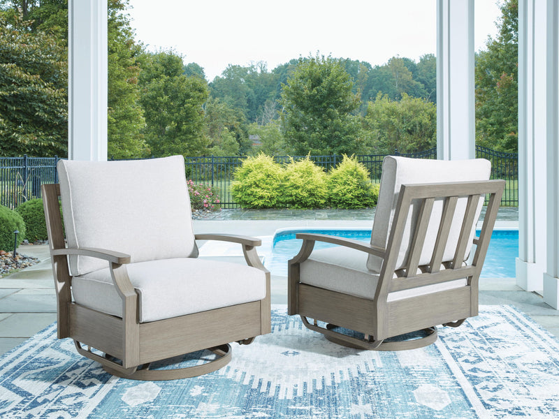 Brown and beige swivel glider chair with cushion from Signature Design by Ashley, featuring a comfortable, modern design.