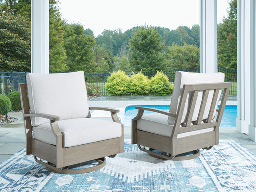 Brown and beige swivel glider chair with cushion from Signature Design by Ashley, featuring a comfortable, modern design.
